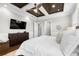 Comfortable main bedroom boasting a tray ceiling, tv and neutral tones at 4806 W San Rafael St, Tampa, FL 33629