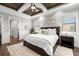 Main bedroom featuring a ceiling fan, windows for natural light and dark wood floors at 4806 W San Rafael St, Tampa, FL 33629