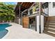 Multi-level outdoor entertainment area featuring a private pool, kitchen and access to storage at 4806 W San Rafael St, Tampa, FL 33629