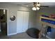 Cozy bedroom with a fun bunk bed, closet, and dart board for entertainment at 4954 Cardinal Trl, Palm Harbor, FL 34683