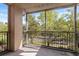 Relax on the screened balcony with peaceful views of nature and beautiful trees at 5125 Palm Springs Blvd # 11306, Tampa, FL 33647