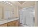 Well-lit bathroom featuring a glass-enclosed shower, updated vanity, and modern fixtures at 5125 Palm Springs Blvd # 11306, Tampa, FL 33647