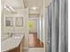 Bright bathroom with dual sinks, granite counters, and a shower-tub combo for ultimate convenience at 5125 Palm Springs Blvd # 11306, Tampa, FL 33647