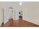 Spacious bedroom featuring beautiful hardwood floors and multiple doorways for convenience and accessibility at 5125 Palm Springs Blvd # 11306, Tampa, FL 33647