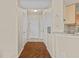 Bright hallway with hardwood flooring, a neutral color scheme, and multiple entryways at 5125 Palm Springs Blvd # 11306, Tampa, FL 33647