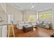 Inviting living room featuring wood floors, ceiling fan, lots of natural light, and neutral paint at 5125 Palm Springs Blvd # 11306, Tampa, FL 33647