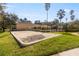 Enjoy an active lifestyle at the community volleyball court with palm trees in the background at 5125 Palm Springs Blvd # 11306, Tampa, FL 33647