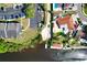 Overhead view of property, showcasing private dock, pool, and convenient parking area at 6208 Imperial Ky, Tampa, FL 33615