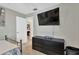 Bedroom view featuring neutral colored walls, tile flooring and television on the wall at 6208 Imperial Ky, Tampa, FL 33615