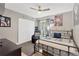 Nicely decorated bedroom featuring a ceiling fan, closet, comfortable furnishings, and unique baseball art at 6208 Imperial Ky, Tampa, FL 33615
