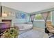Guest bedroom features a daybed, stylish lighting and decor and nice blue walls at 6208 Imperial Ky, Tampa, FL 33615