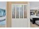 Hallway view with a paneled closet separating two bedrooms with neutral color palates at 6208 Imperial Ky, Tampa, FL 33615