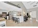 Open-concept kitchen with stainless steel appliances and granite countertops, seamlessly connecting to the living area at 6208 Imperial Ky, Tampa, FL 33615