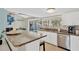 Bright kitchen featuring granite counters, stainless appliances and view to outdoor pool at 6208 Imperial Ky, Tampa, FL 33615