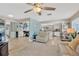 Open concept living space with kitchen view, tile floors, and a ceiling fan at 6208 Imperial Ky, Tampa, FL 33615
