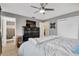 Bedroom with a large bed, dresser, ensuite bathroom and closet storage at 6208 Imperial Ky, Tampa, FL 33615