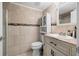 Well-lit bathroom features tiled walls, a vanity with a marble countertop, and a glass-enclosed shower at 6262 142Nd N Ave # 1304, Clearwater, FL 33760