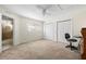 Bright bedroom with large windows, dual closets, and a ceiling fan, offering comfort and plenty of natural light at 6262 142Nd N Ave # 1304, Clearwater, FL 33760