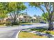 Exterior view of townhomes showing well-maintained landscaping, private patios, and ample parking at 6262 142Nd N Ave # 1304, Clearwater, FL 33760