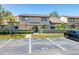 Inviting home exterior featuring manicured landscaping, mature trees, and convenient guest parking at 6262 142Nd N Ave # 1304, Clearwater, FL 33760