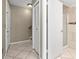 Neutral hallway with a tiled floor and white doors, creating a clean and inviting transition between spaces at 6262 142Nd N Ave # 1304, Clearwater, FL 33760