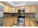 Charming kitchen features granite counters, stainless steel oven, modern backsplash, and lots of cabinets at 6262 142Nd N Ave # 1304, Clearwater, FL 33760