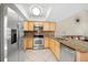 Well-appointed kitchen boasts stainless steel appliances, generous counter space, and plentiful cabinets at 6262 142Nd N Ave # 1304, Clearwater, FL 33760