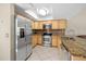 Updated kitchen with stainless appliances, ample cabinetry, modern lighting, and functional layout at 6262 142Nd N Ave # 1304, Clearwater, FL 33760