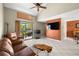 Cozy living room with vaulted ceiling, neutral walls, patio access, and decorative touches at 6262 142Nd N Ave # 1304, Clearwater, FL 33760