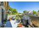 Private patio with a grill, comfortable seating, and potted plants, perfect for outdoor dining and relaxation at 6262 142Nd N Ave # 1304, Clearwater, FL 33760