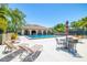 Community pool area with lounge chairs, umbrella tables, and a covered seating area perfect for relaxation at 6262 142Nd N Ave # 1304, Clearwater, FL 33760