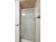 Updated shower featuring decorative tiled walls, glass door, and modern fixtures at 6262 142Nd N Ave # 1304, Clearwater, FL 33760