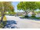 Street view of the Via Verde community showing the entrance sign and well-maintained townhome exteriors at 6262 142Nd N Ave # 1304, Clearwater, FL 33760