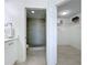 This primary bathroom includes a step-in shower with beautiful tile and glass doors with a walk-in closet at 7862 Sailboat Key S Blvd # 103, South Pasadena, FL 33707