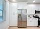 Bright kitchen features white cabinets, stainless steel appliances, and pantry at 7862 Sailboat Key S Blvd # 103, South Pasadena, FL 33707