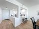 Bright, open-concept kitchen featuring white cabinetry, breakfast bar, and modern finishes at 7862 Sailboat Key S Blvd # 103, South Pasadena, FL 33707