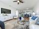 Living room open to dining area with water views and comfortable seating at 7862 Sailboat Key S Blvd # 103, South Pasadena, FL 33707