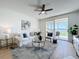Bright living room offering views of the waterfront from a private balcony at 7862 Sailboat Key S Blvd # 103, South Pasadena, FL 33707