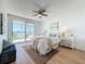 Main bedroom featuring natural light, sliding glass doors to a balcony, and water views at 7862 Sailboat Key S Blvd # 103, South Pasadena, FL 33707