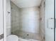Modern shower with glass enclosure, stylish tile, and updated fixtures in a bright, renovated bathroom at 7862 Sailboat Key S Blvd # 103, South Pasadena, FL 33707