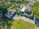 Expansive aerial view of home highlighting pool, yard, and driveway at 8205 Overlook Ne Pl, St Petersburg, FL 33702