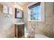 Elegant bathroom featuring a vanity, mirror, travertine tile, and a glass-enclosed shower at 8205 Overlook Ne Pl, St Petersburg, FL 33702