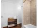 Cozy bathroom featuring a tiled shower, modern drawer storage, and towels at 8205 Overlook Ne Pl, St Petersburg, FL 33702