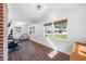 This bonus room features hardwood floors, natural light, and neutral paint at 8205 Overlook Ne Pl, St Petersburg, FL 33702