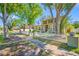Charming home with mature trees and manicured landscaping framed by a classic white picket fence for timeless curb appeal at 8205 Overlook Ne Pl, St Petersburg, FL 33702