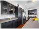 The updated kitchen has granite countertops, stainless appliances, and dark cabinets at 8205 Overlook Ne Pl, St Petersburg, FL 33702
