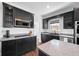 The renovated kitchen features stainless appliances and granite countertops at 8205 Overlook Ne Pl, St Petersburg, FL 33702