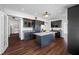 Spacious kitchen featuring dark cabinets, center island, and stainless steel appliances at 8205 Overlook Ne Pl, St Petersburg, FL 33702