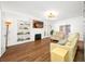 Inviting living room features custom bookshelves, hardwood floors, and a fireplace at 8205 Overlook Ne Pl, St Petersburg, FL 33702