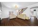 Spacious living area features hardwood floors and a staircase leading to the second floor at 8205 Overlook Ne Pl, St Petersburg, FL 33702